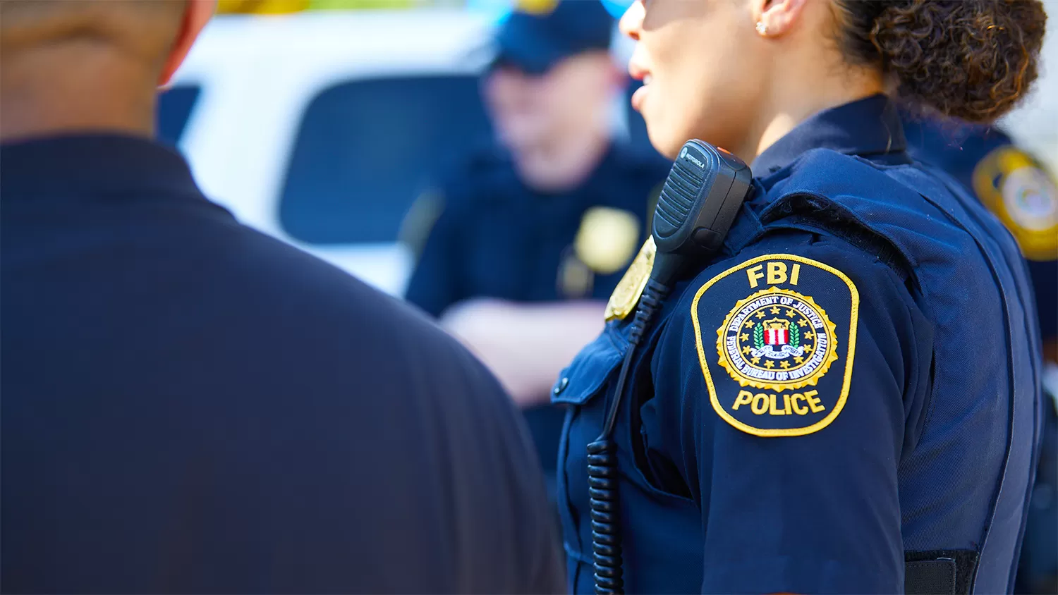 A zoomed in visual of the FBI police officer seal on their uniforms